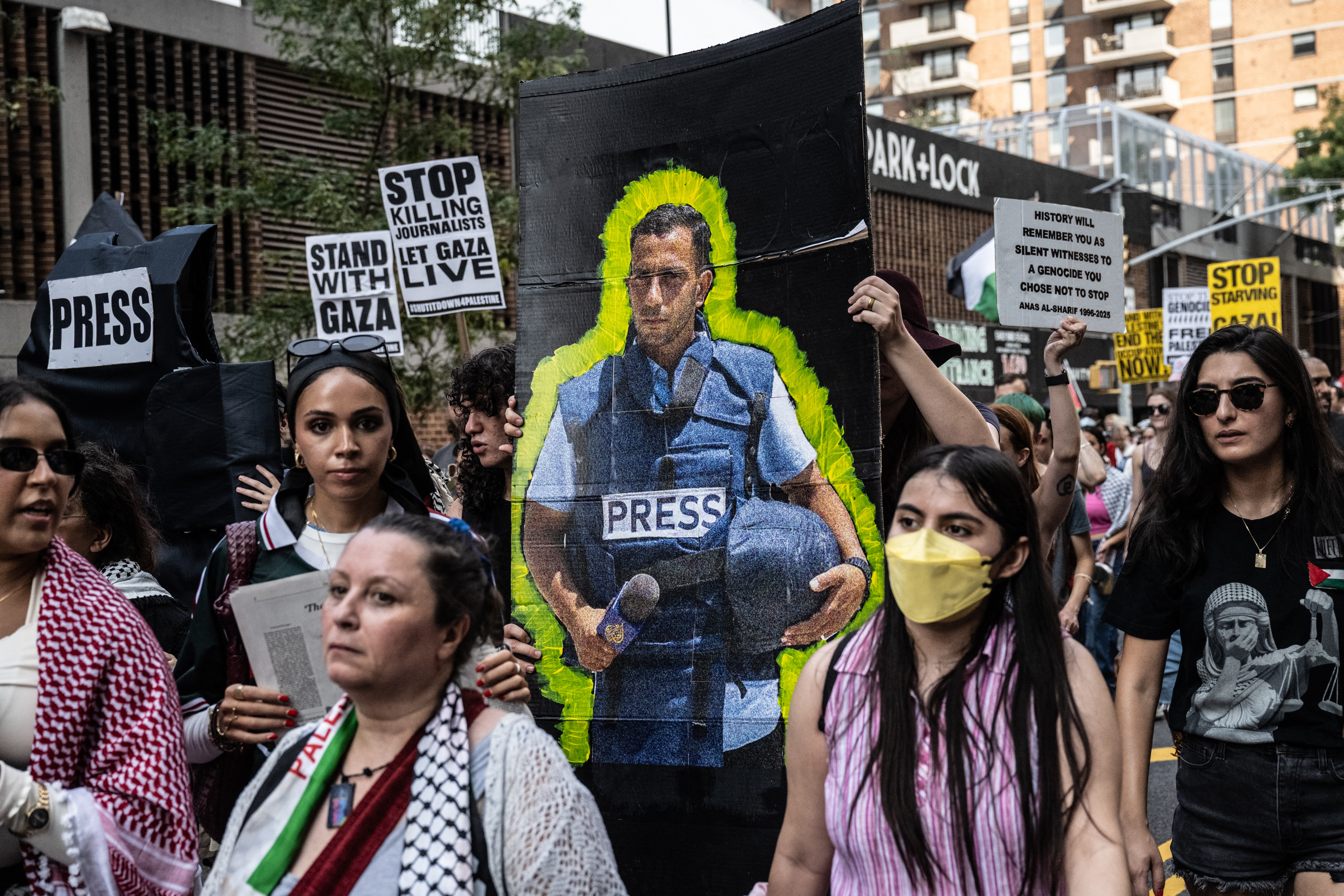 NEW YORK, NEW YORK - AUGUST 16: A person holds a photo of slain Al Jazeera journalist Anas al-Sharif, as Pro-Palestinian protesters participate in a "March for Humanity" against the humanitarian crisis in Gaza on August 16, 2025 in New York City.