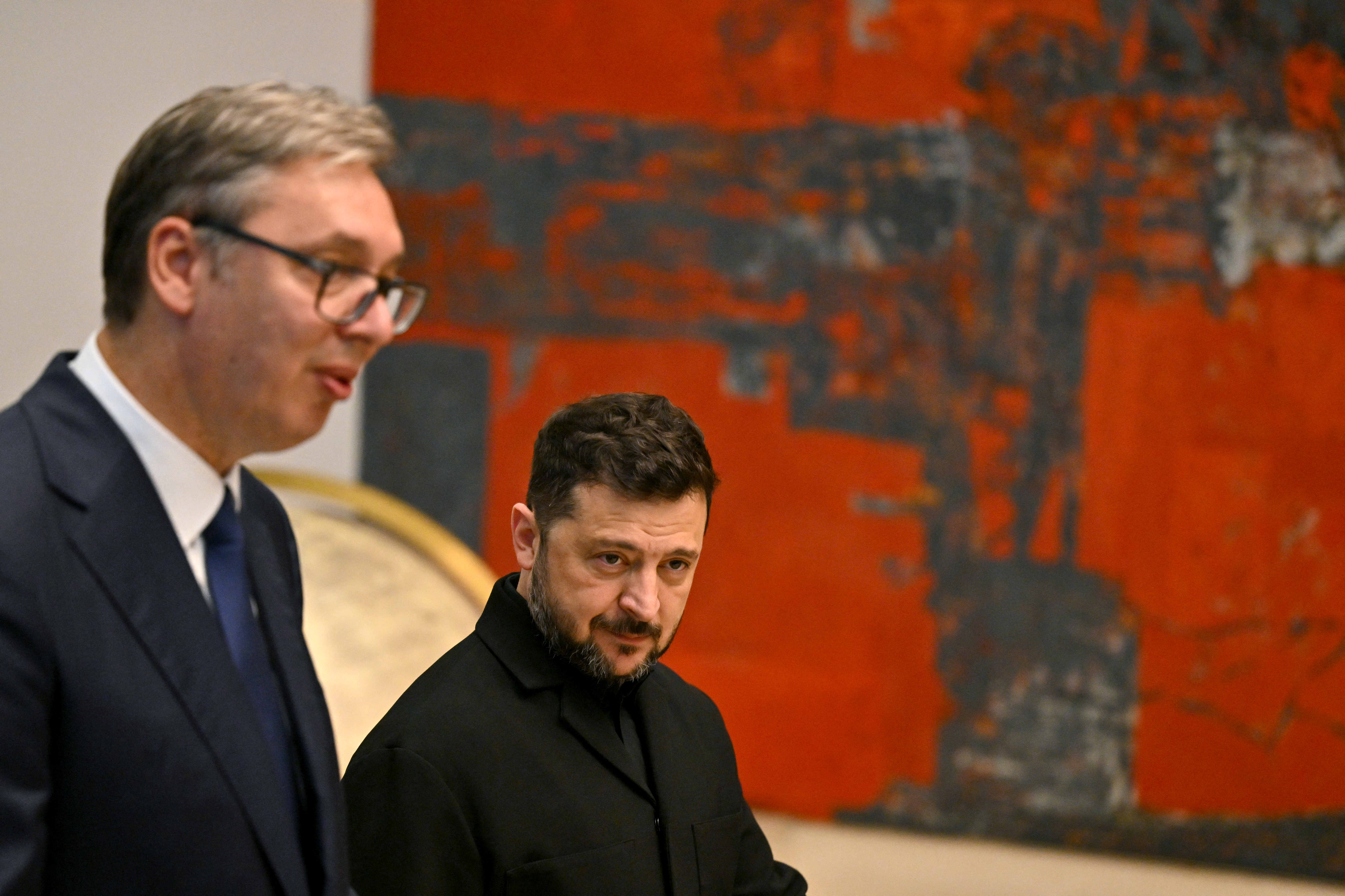 Serbia's President Aleksandar Vucic (L) and Ukraine's President Volodymyr Zelensky arrive to attend their meeting at the Palace of Serbia, in Belgrade on August 8, 2026.