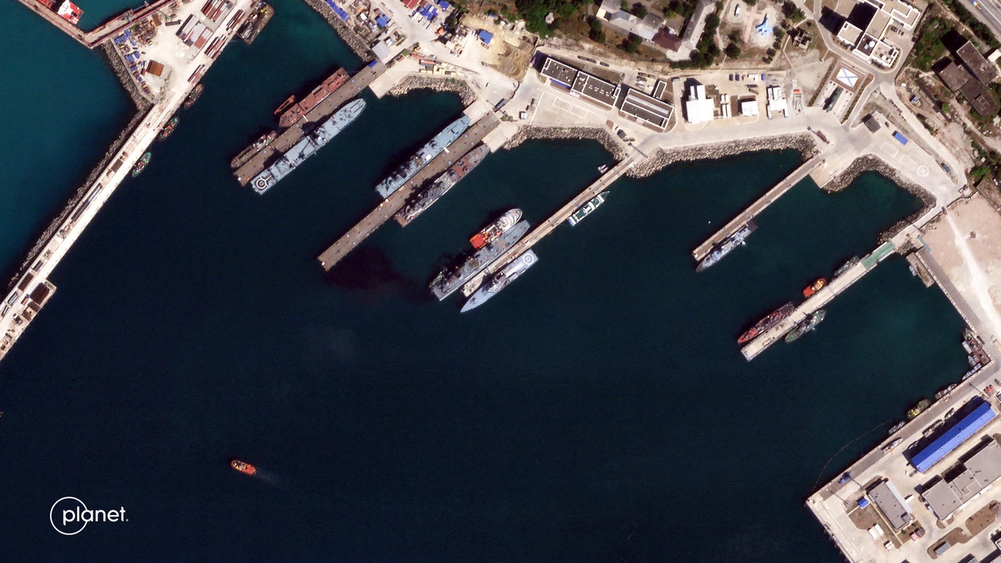 This handout satellite image released by Planet Labs PBC on August 7, 2023, shows an aerial view of the port Novorossiysk, south of the Kerch Strait, where a Russian oil and chemical tanker was hit by a Ukrainian drone attack.