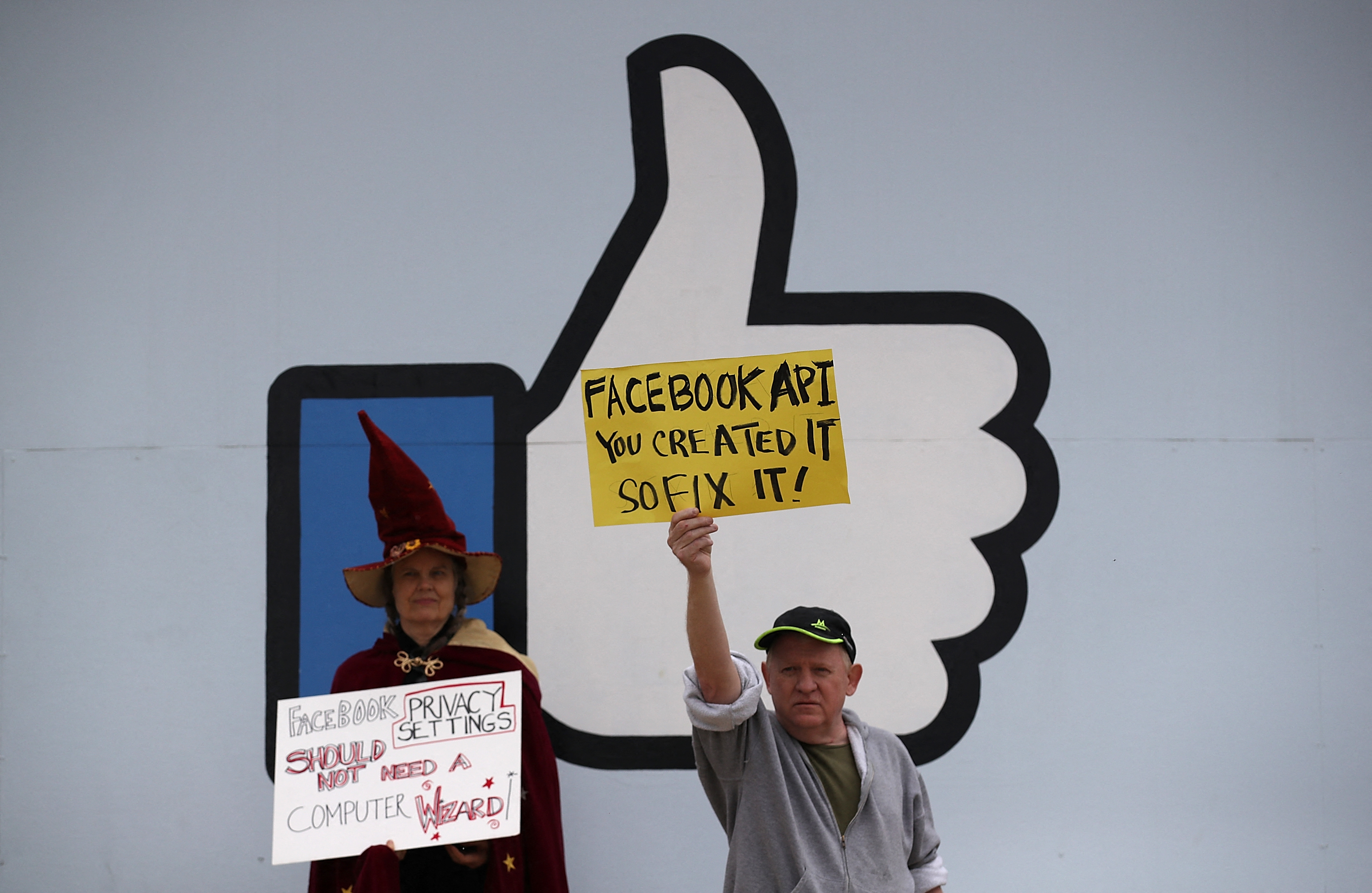 MENLO PARK, CA - APRIL 05: Protesters with the group "Raging Grannies" hold signs during a demonstration outside of Facebook headquarters on April 5, 2018 in Menlo Park, California