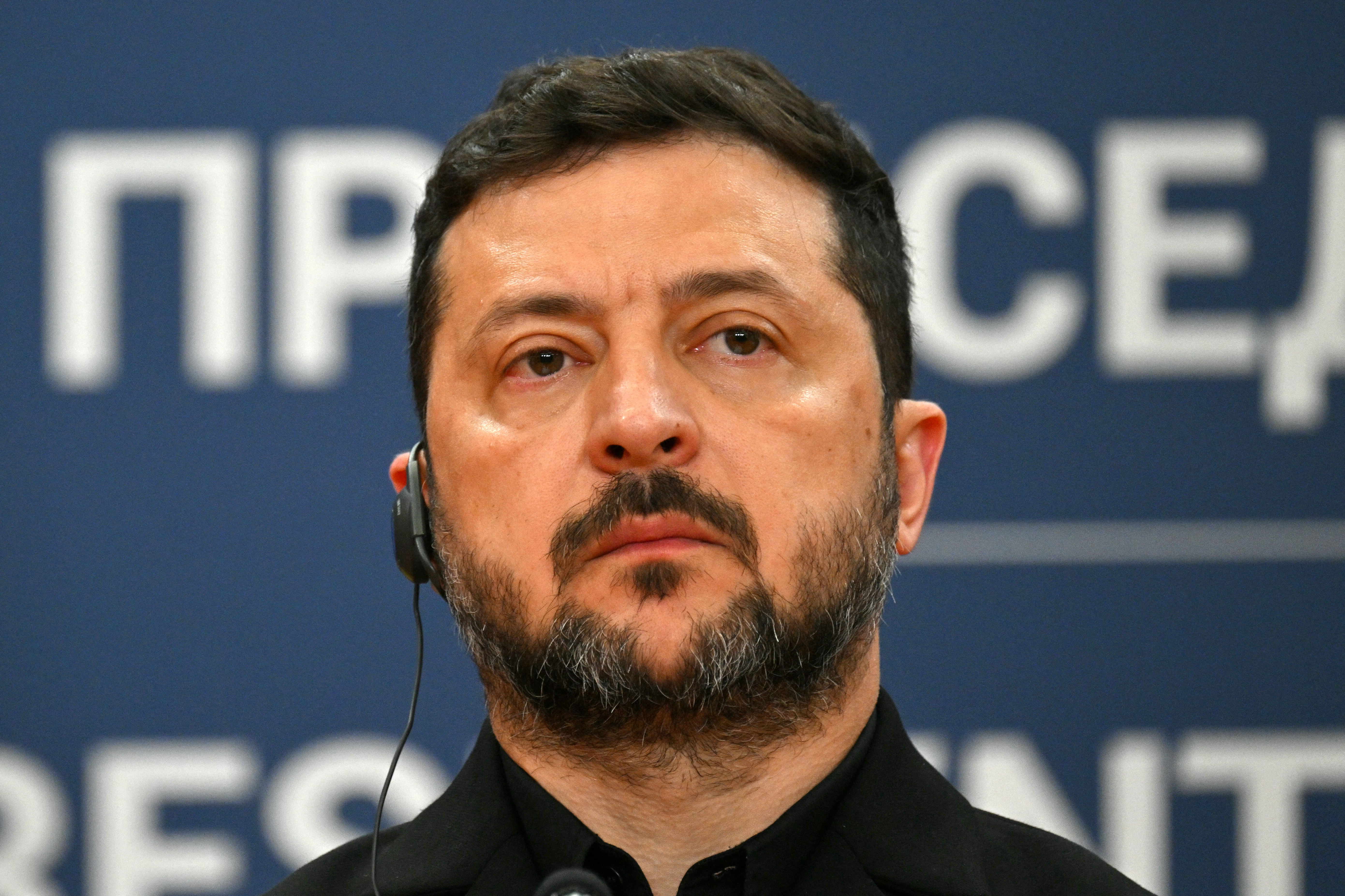 Ukraine's President Volodymyr Zelensky listens during a joint press conference with Serbia's President following their meeting at the Palace of Serbia, in Belgrade on August 8, 2026. (Photo by Andrej ISAKOVIC / AFP)
