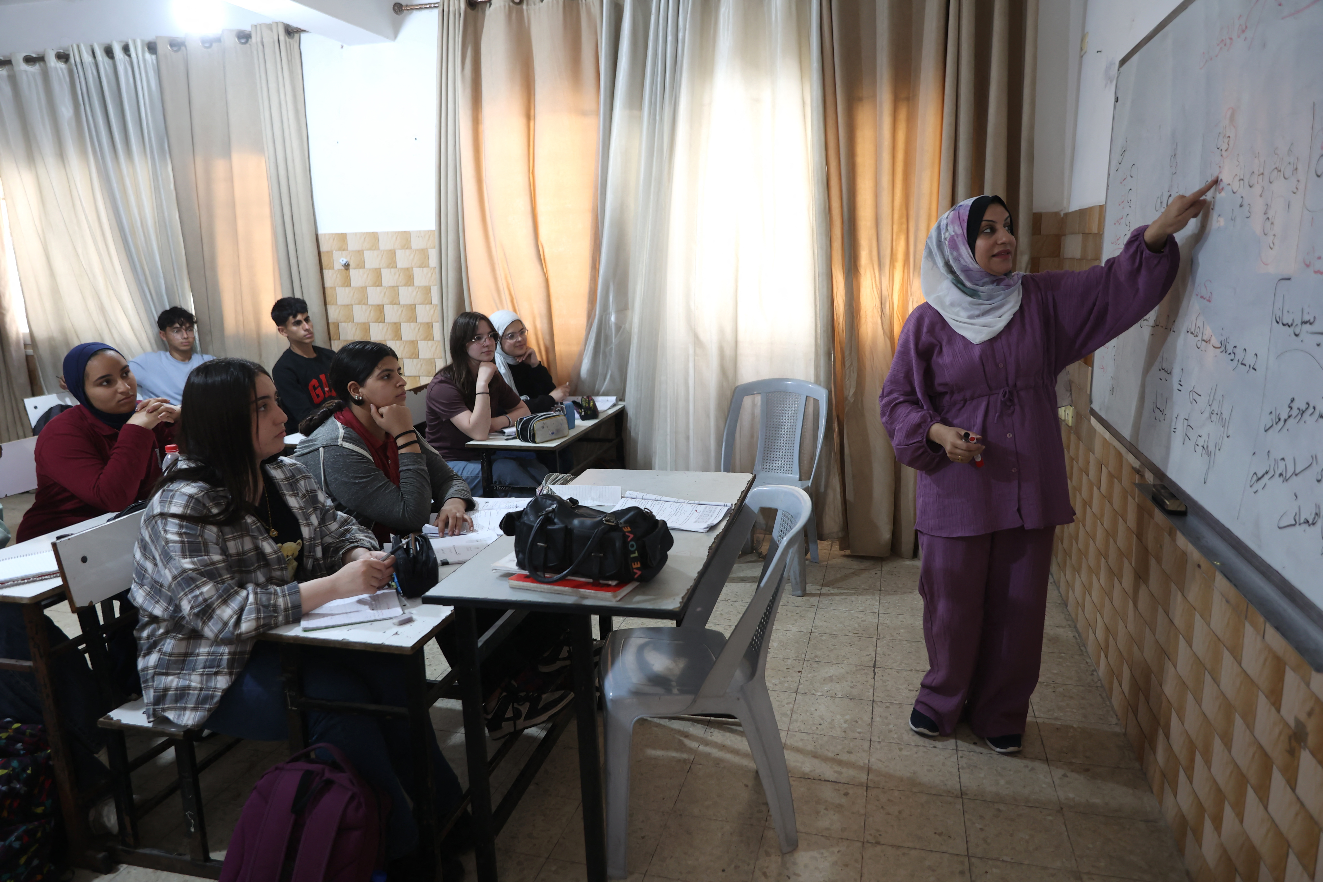 Muslim and Christian Palestinian youngsters attend lessons at the Latin Patriarchate School, inside the Catholic Church of the Holy Family, in the Zeitoun neighborhood, in Gaza City on May 11, 2026.