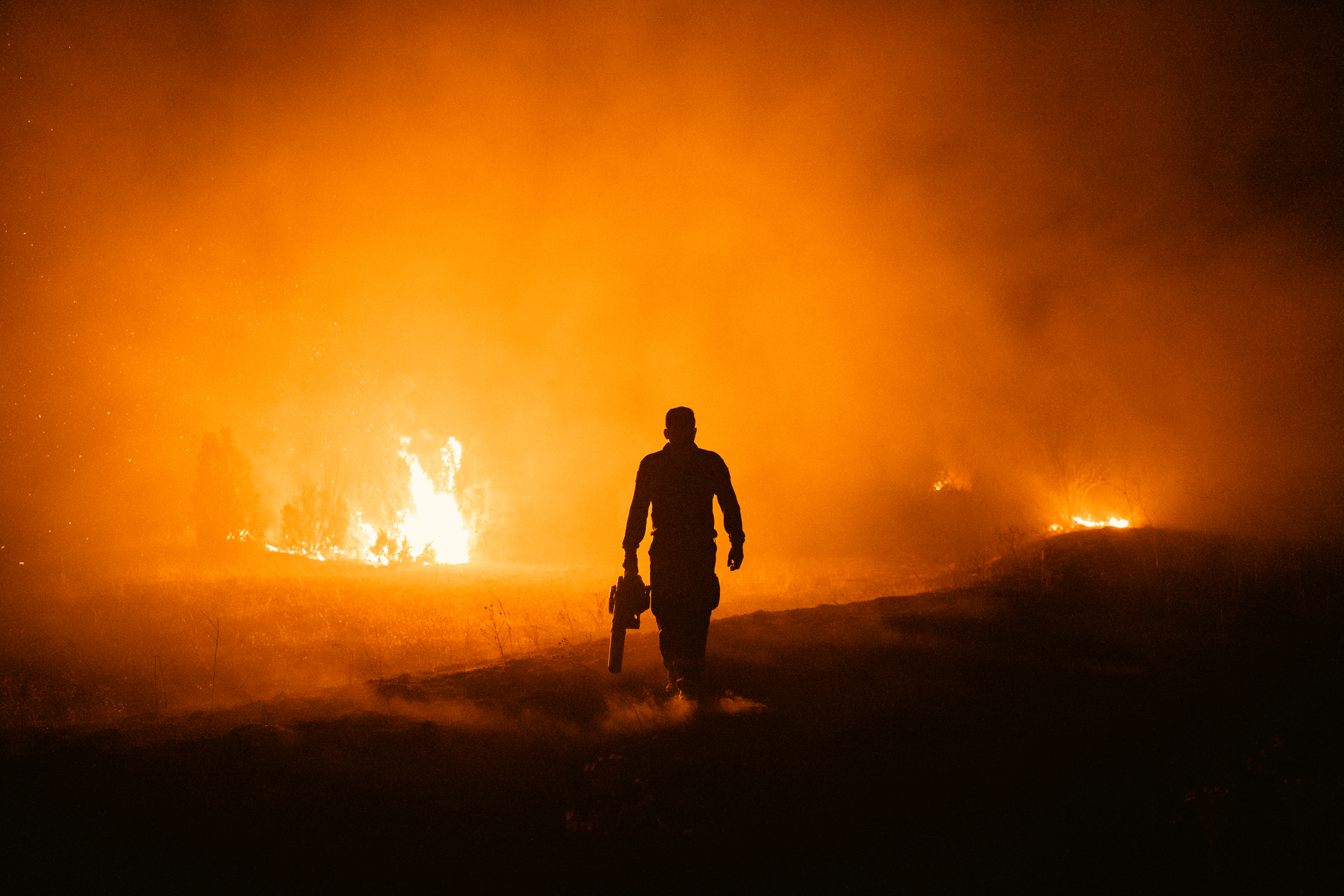 A firefighter battles a wildfire in Deliblatska Pescara (Deliblato Sands), near the village of Dubovac, some 70 kilometres northeast of Belgrade, Serbia, on August 9, 2026.