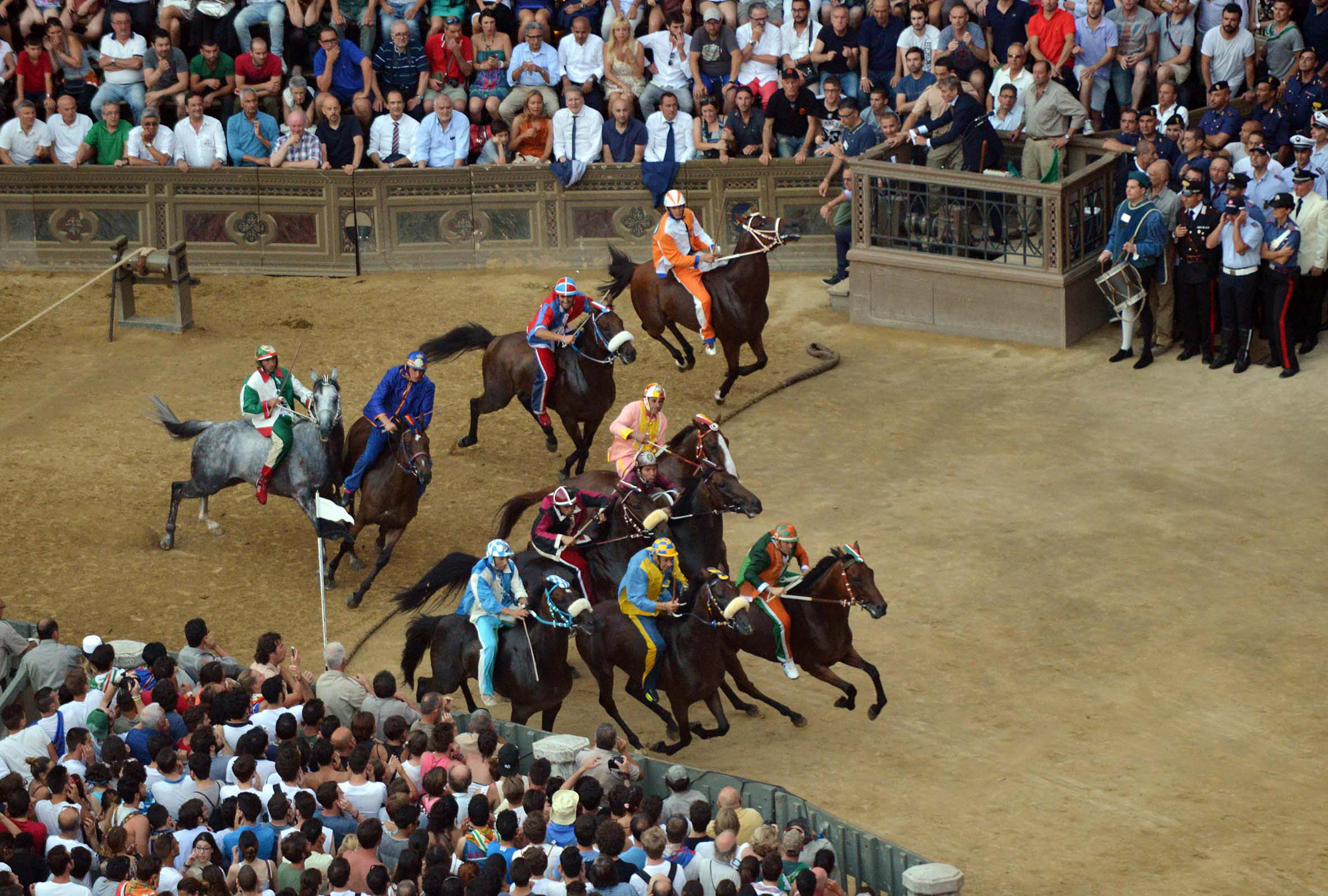 Riders start the race of the "Palio di Siena". (AP Photo/Paolo Lazzeroni)