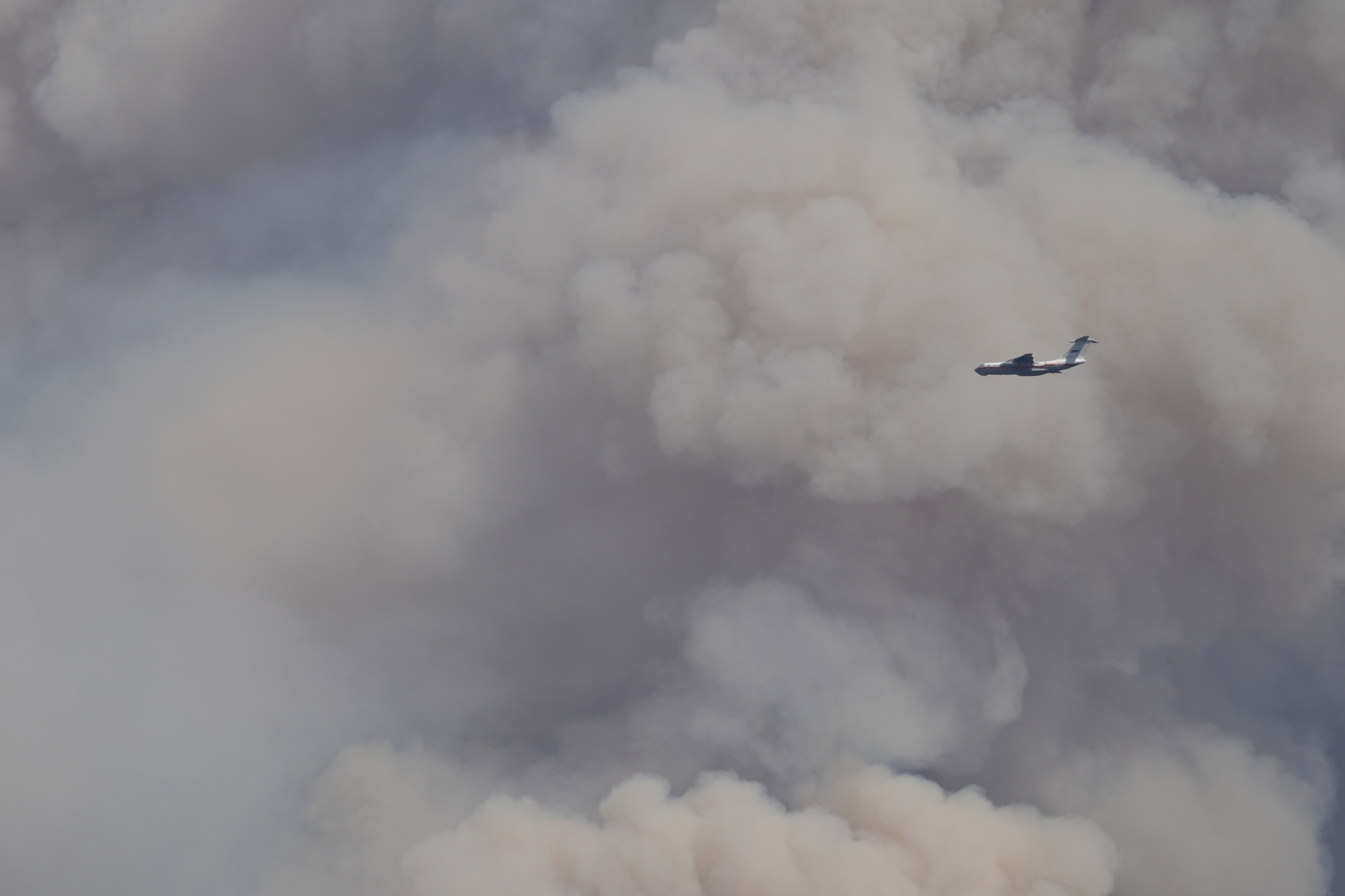 A Russian Il-76 firefighting plane battles a forest fire in Deliblatska Pescara. (AP Photo/Darko Vojinovic)