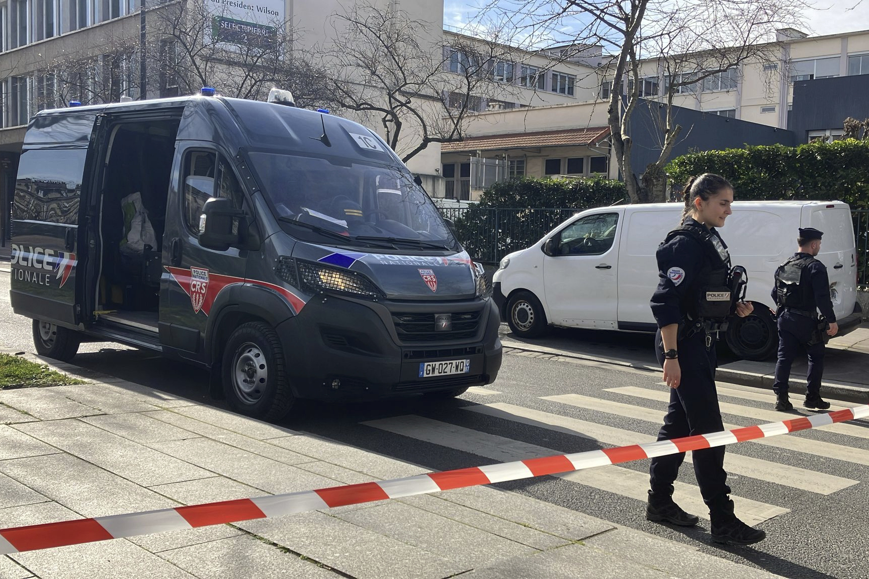 Police officers secure the area near an unexploded World War II-era bomb. (AP Photo/Nicolas Garriga)
