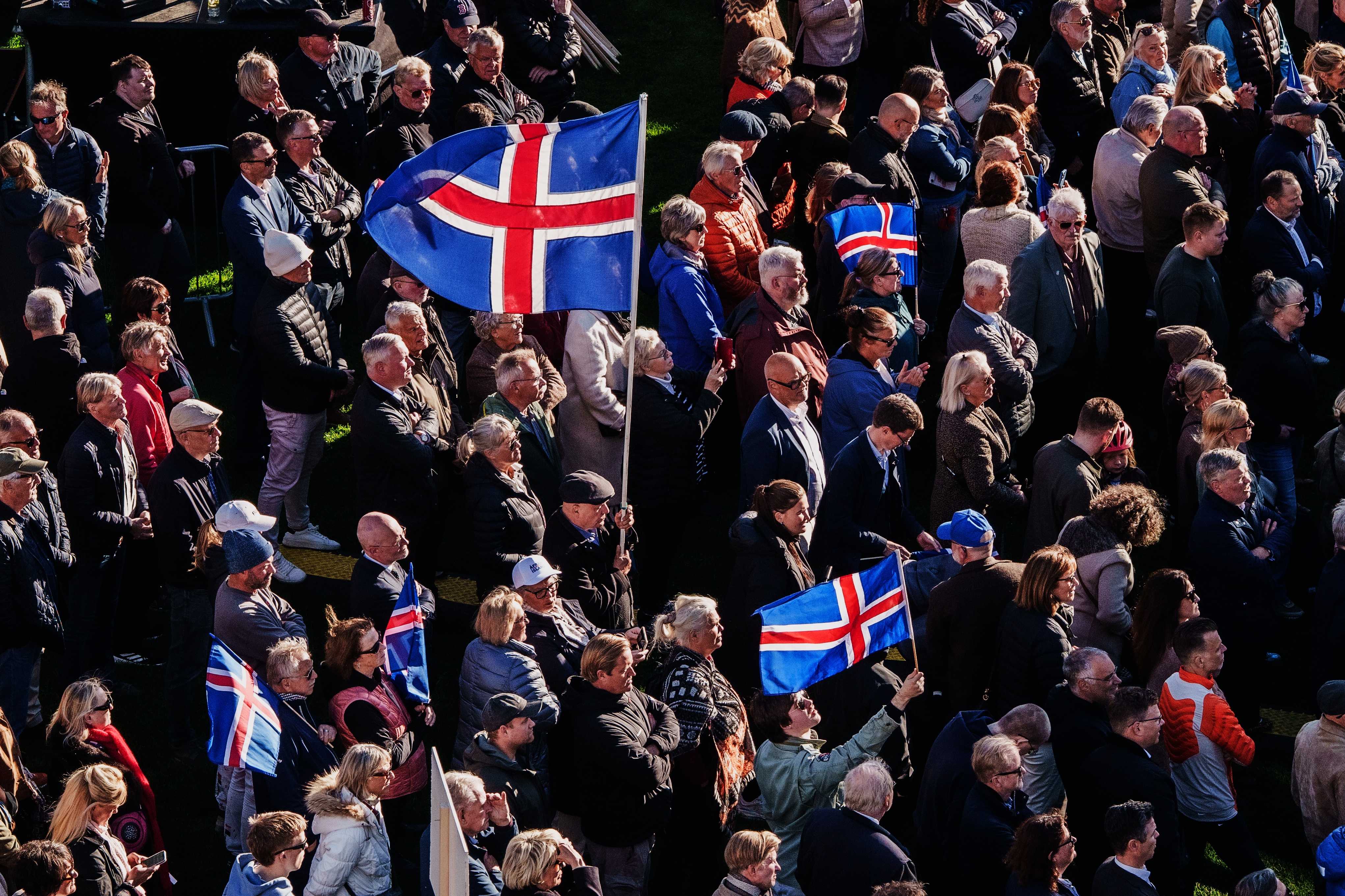 People with Icelandic flags. (AP Photo/Marco Di Marco