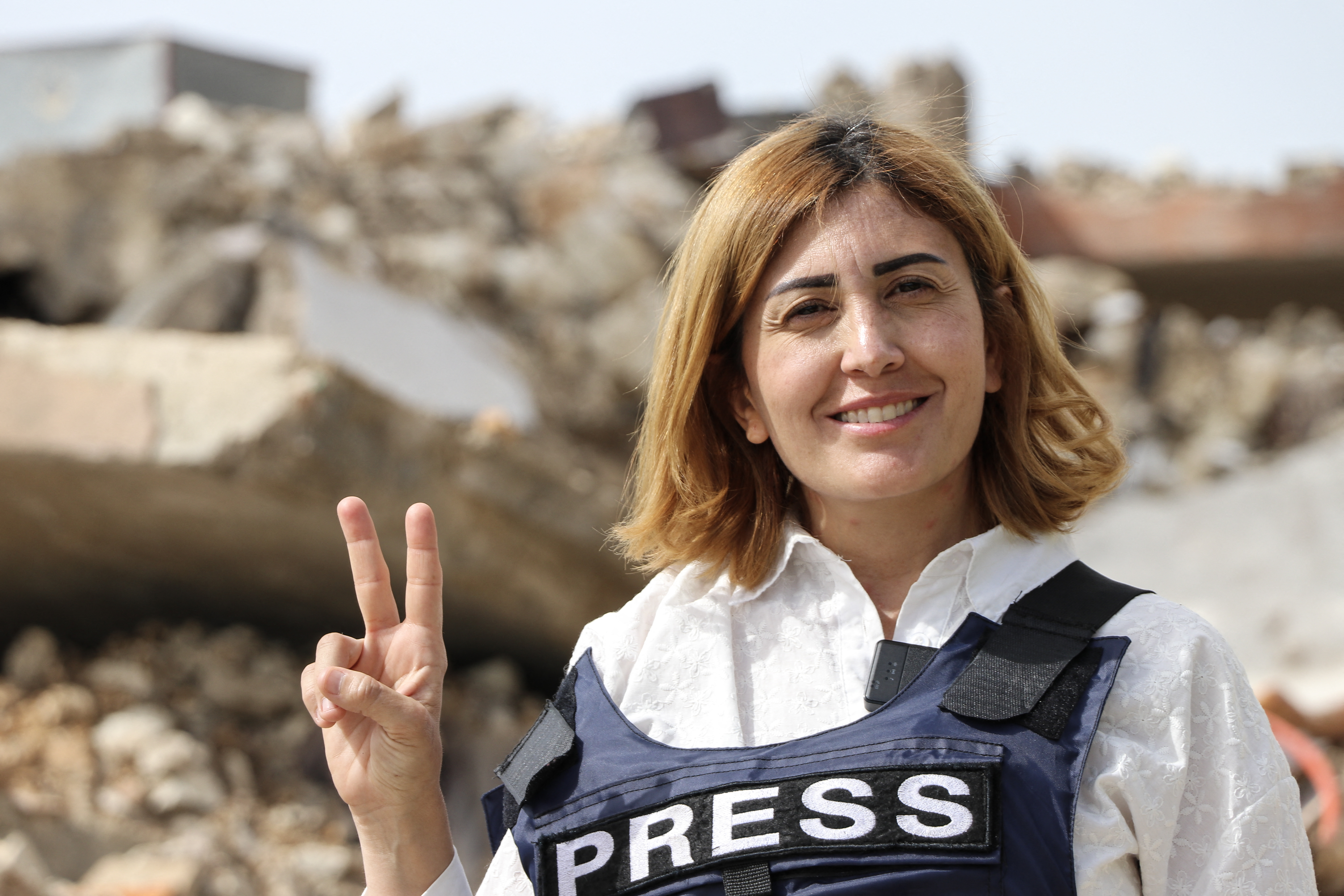 A photograph shows Amal Khalil, a veteran correspondent for the daily newspaper Al-Akhbar, in the southern Lebanese border village of Jebbayn in 2024. (Photo by AFP)