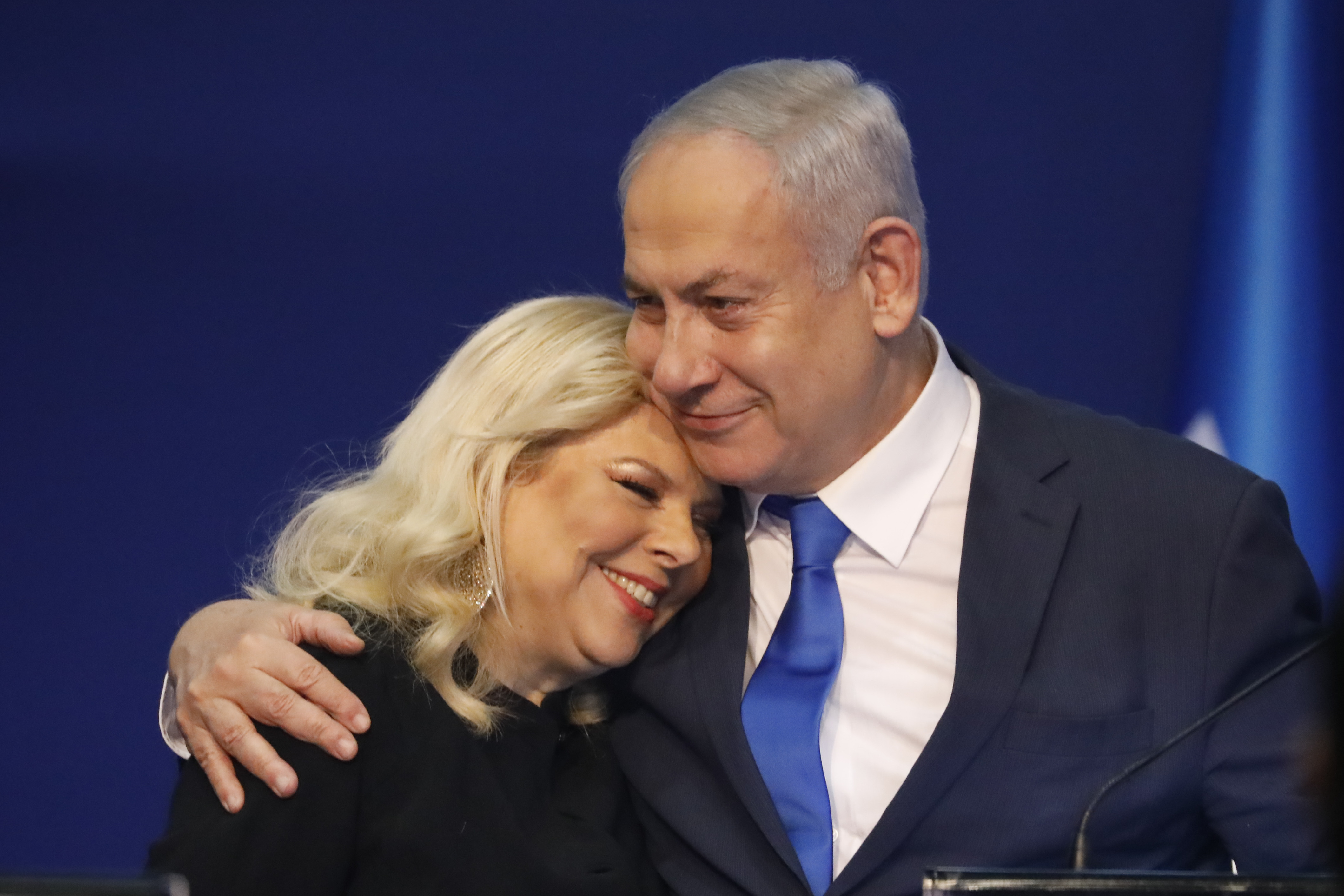 Israeli Prime Minister Benjamin Netanyahu hugs his wife Sara. (AP Photo/Ariel Schalit)