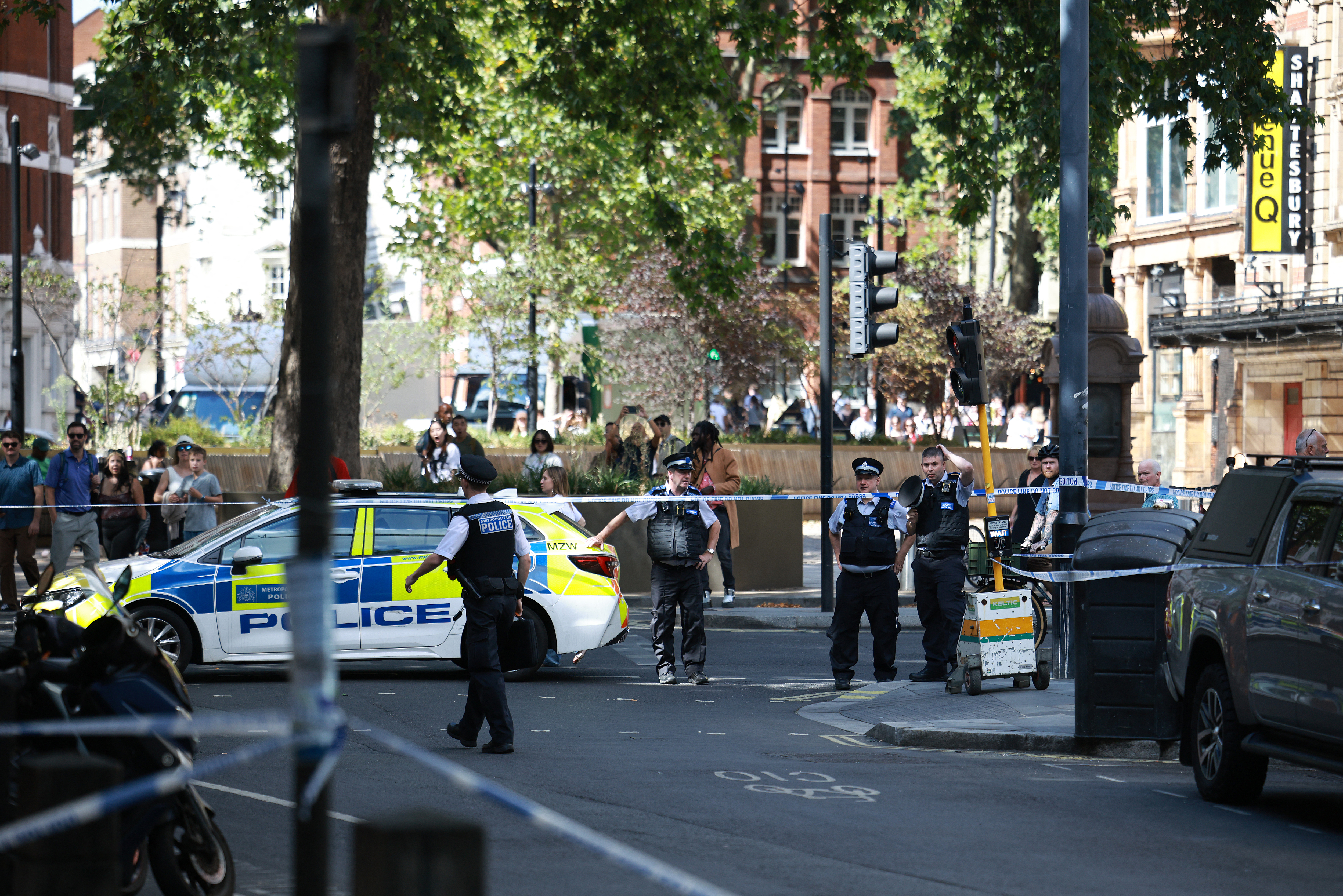Police Officers. (Photo by Henry NICHOLLS / AFP)