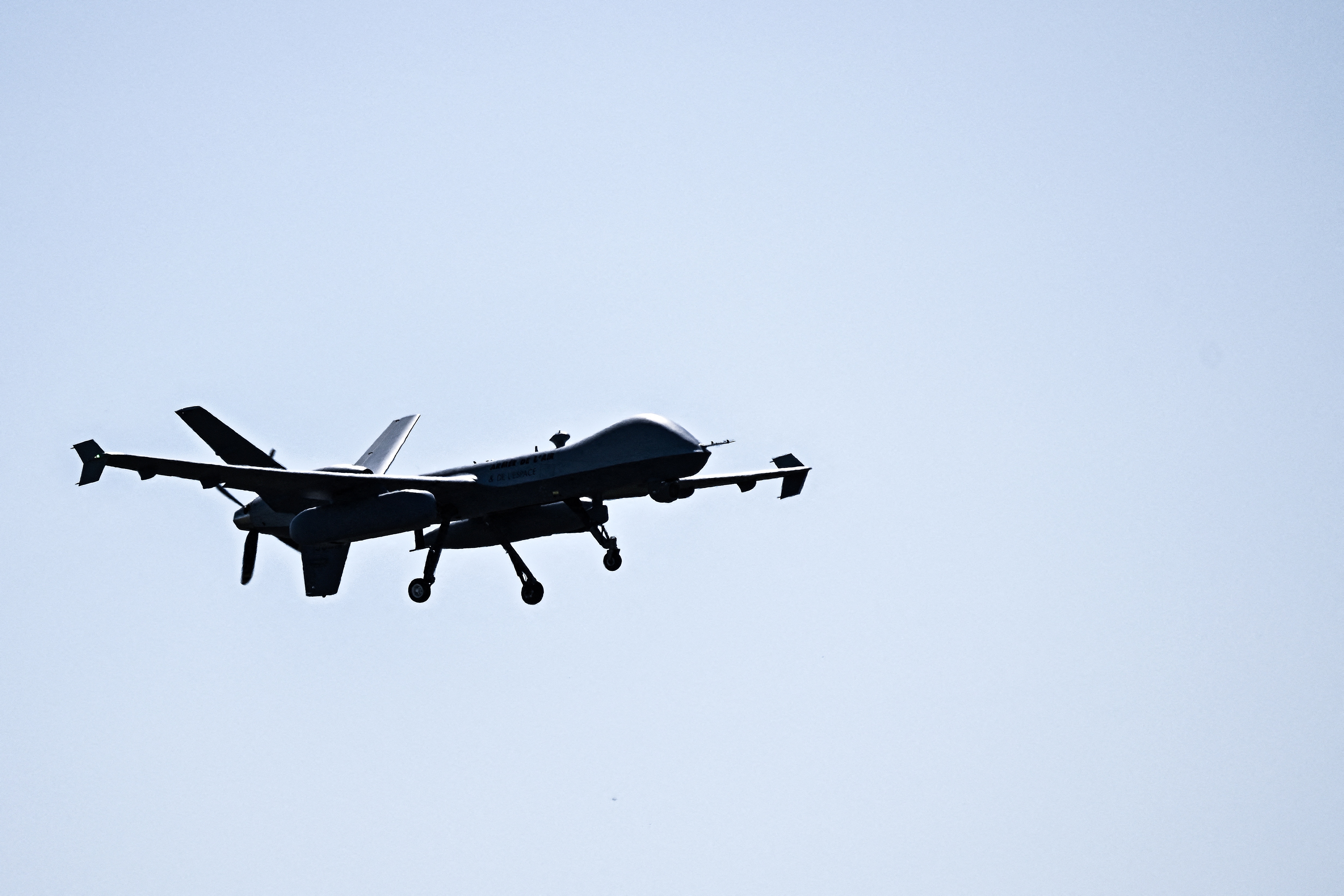 An MQ-9 Reaper military drone flies during a training flight as part of missions of the 33rd Surveillance, Reconnaissance and Attack Wing (Escadre de surveillance, de reconnaisance et d'attaque - ESRA) at the Cognac air base in Chateaubernard