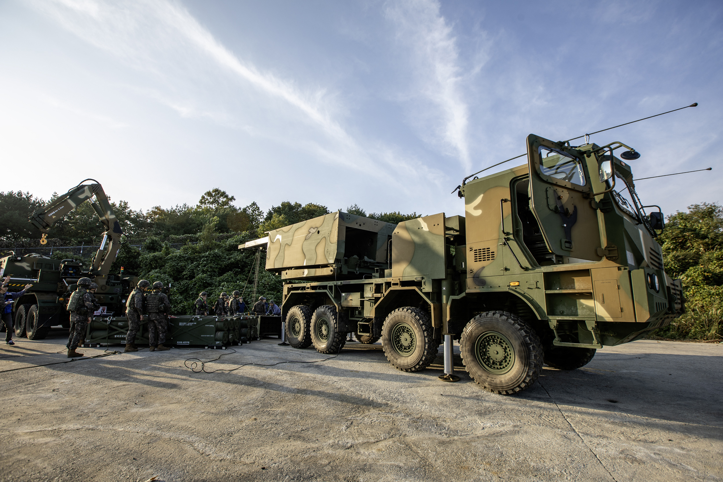 South Korean soldiers deploying the multiple launch rocket system Chunmoo during a live-fire drill in the border county of Goseong. (Photo by Handout / South Korean Defence Ministry / AFP)