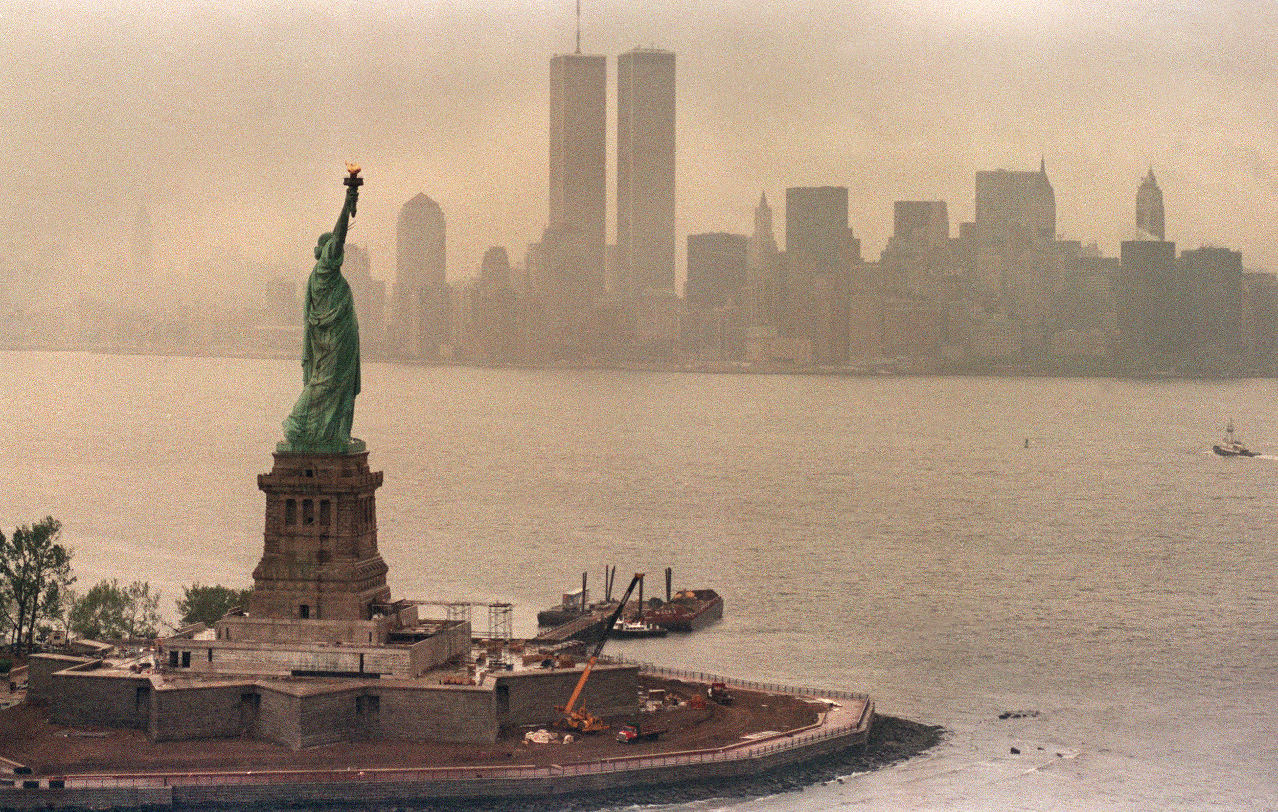 A picture taken 20 May 1986 in New York shows the Statue of Liberty and the Twin Towers of the World Trade Center in the background.