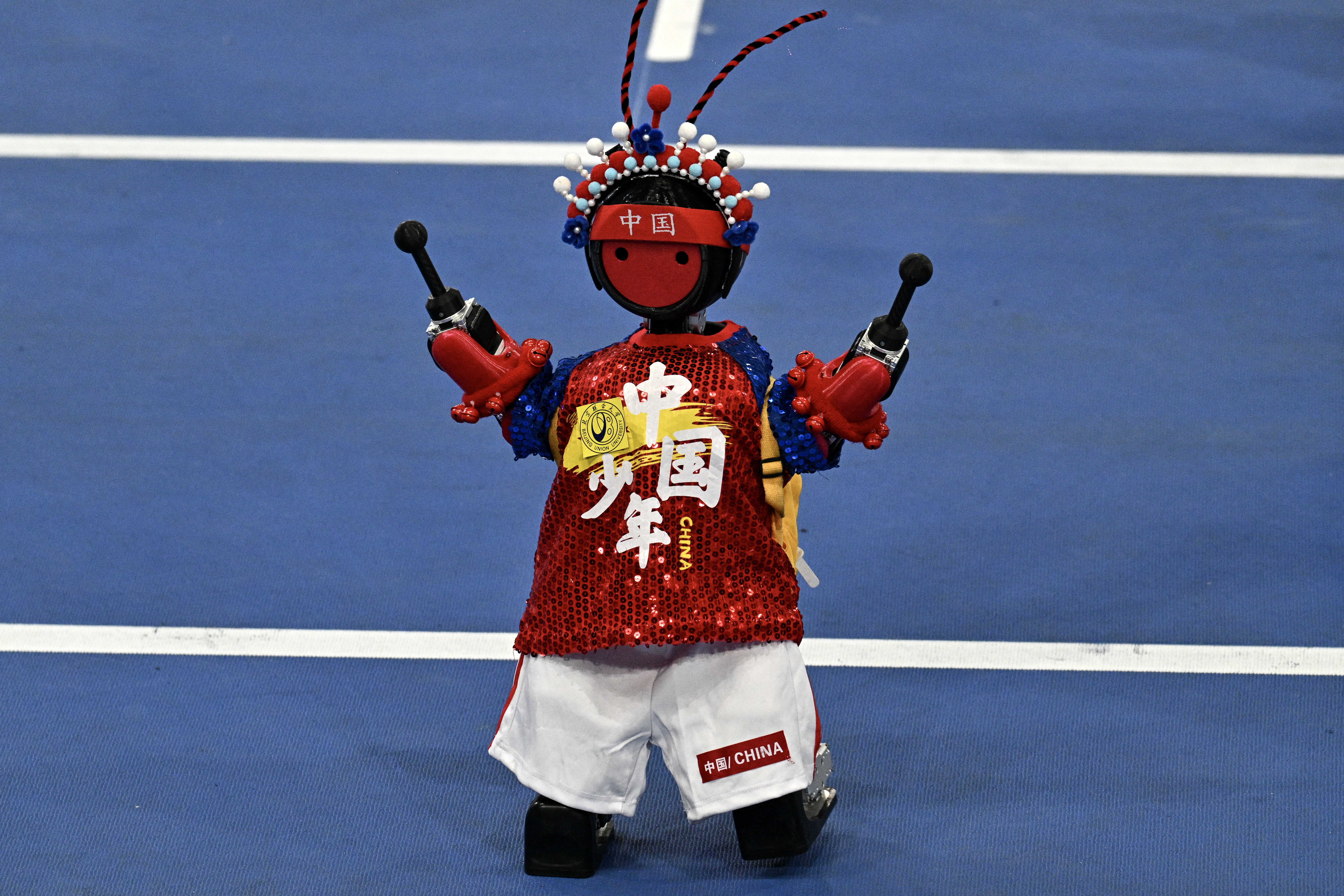 A humanoid robot takes part in the opening ceremony of the 2nd World Humanoid Robot Games in Beijing on August 22, 2026.