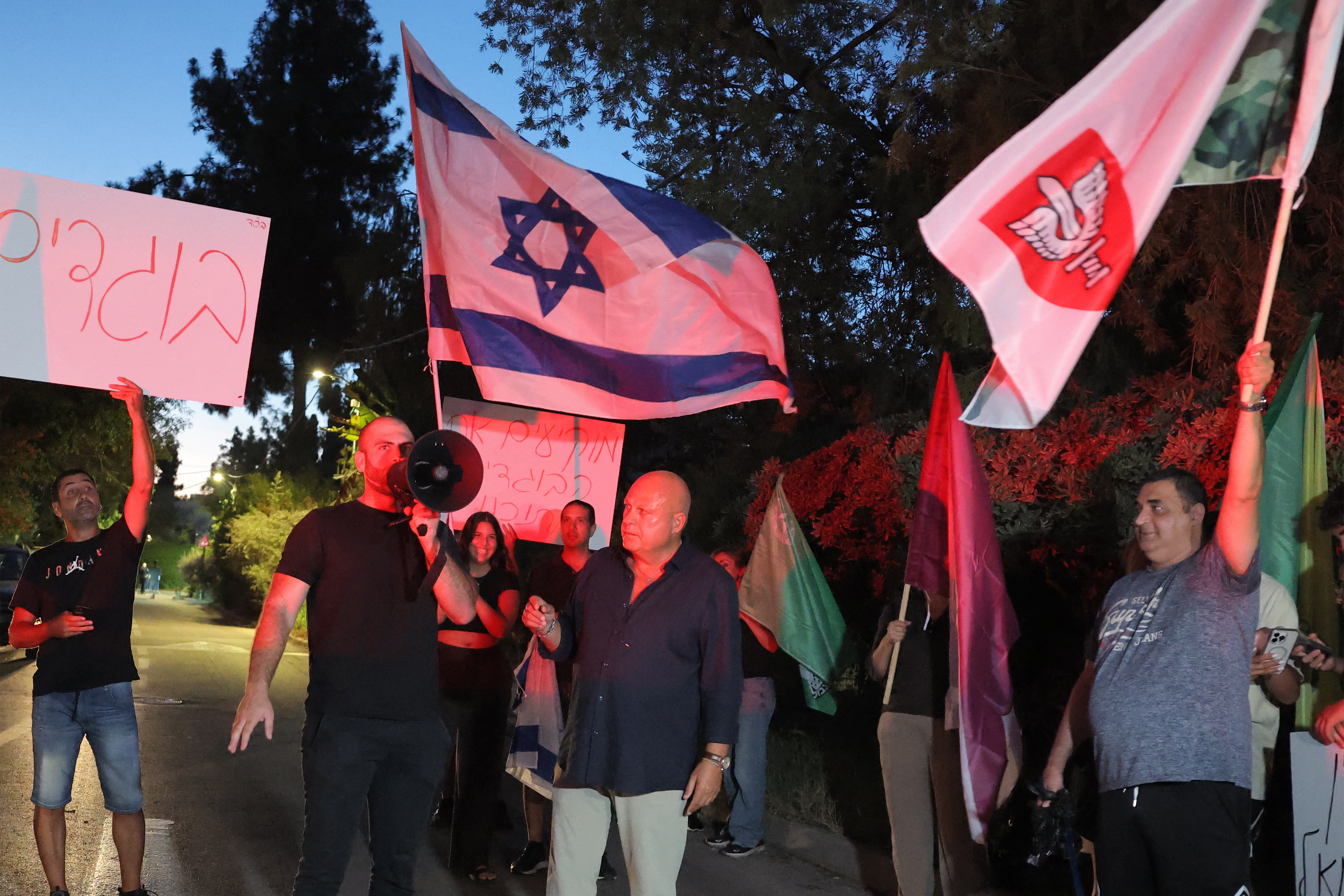 Right-wing activists protesting the 2026 documentary film "NAZA" demonstrate outside the home of the family of its co-director Rachel Szor in Israel's central city of Savyon near Tel Aviv