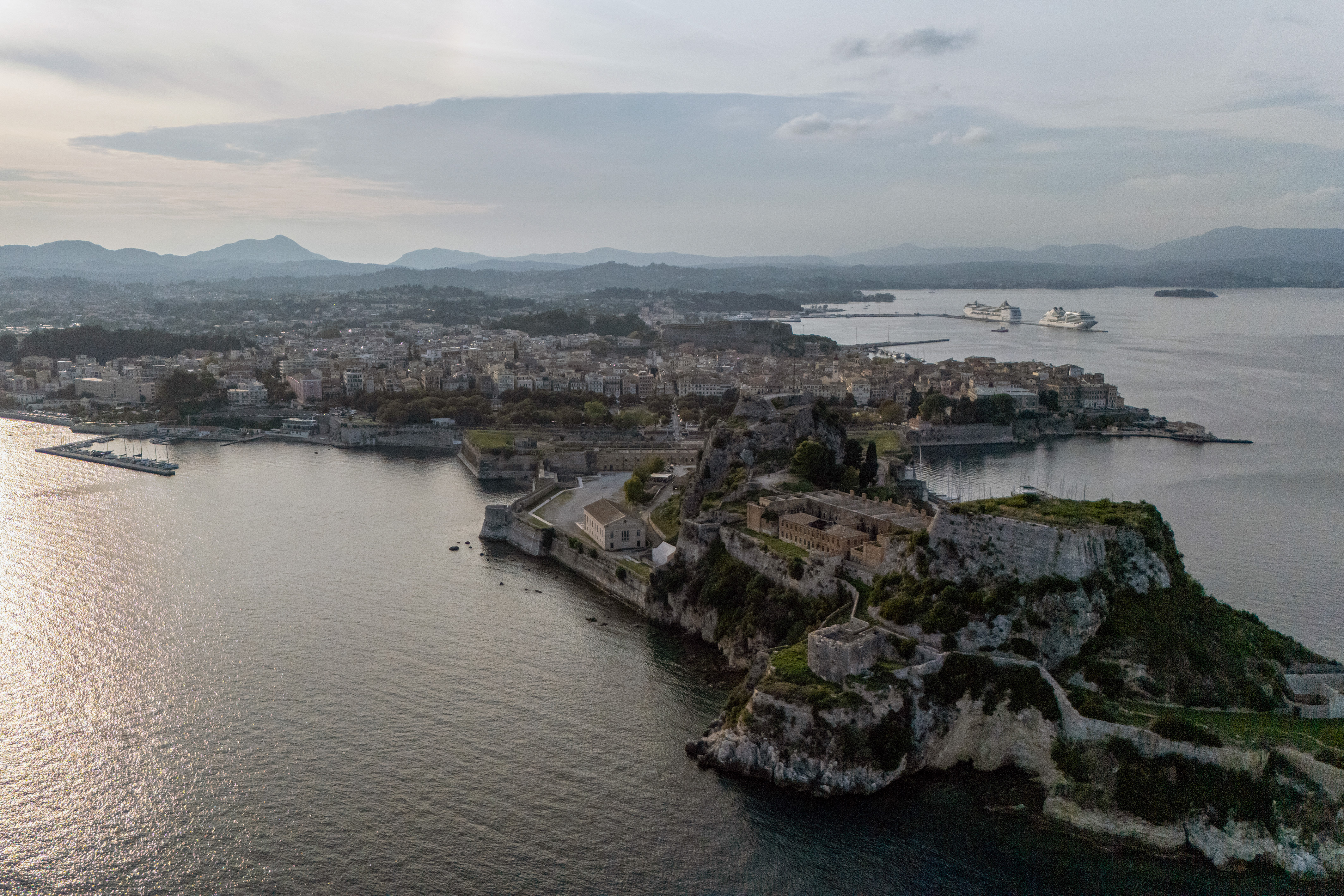 This aerial photo shows a view of the city of Corfu on October 15, 2025. In a country where many think nothing of dumping used appliances, old furniture and even toilets on the street with their garbage