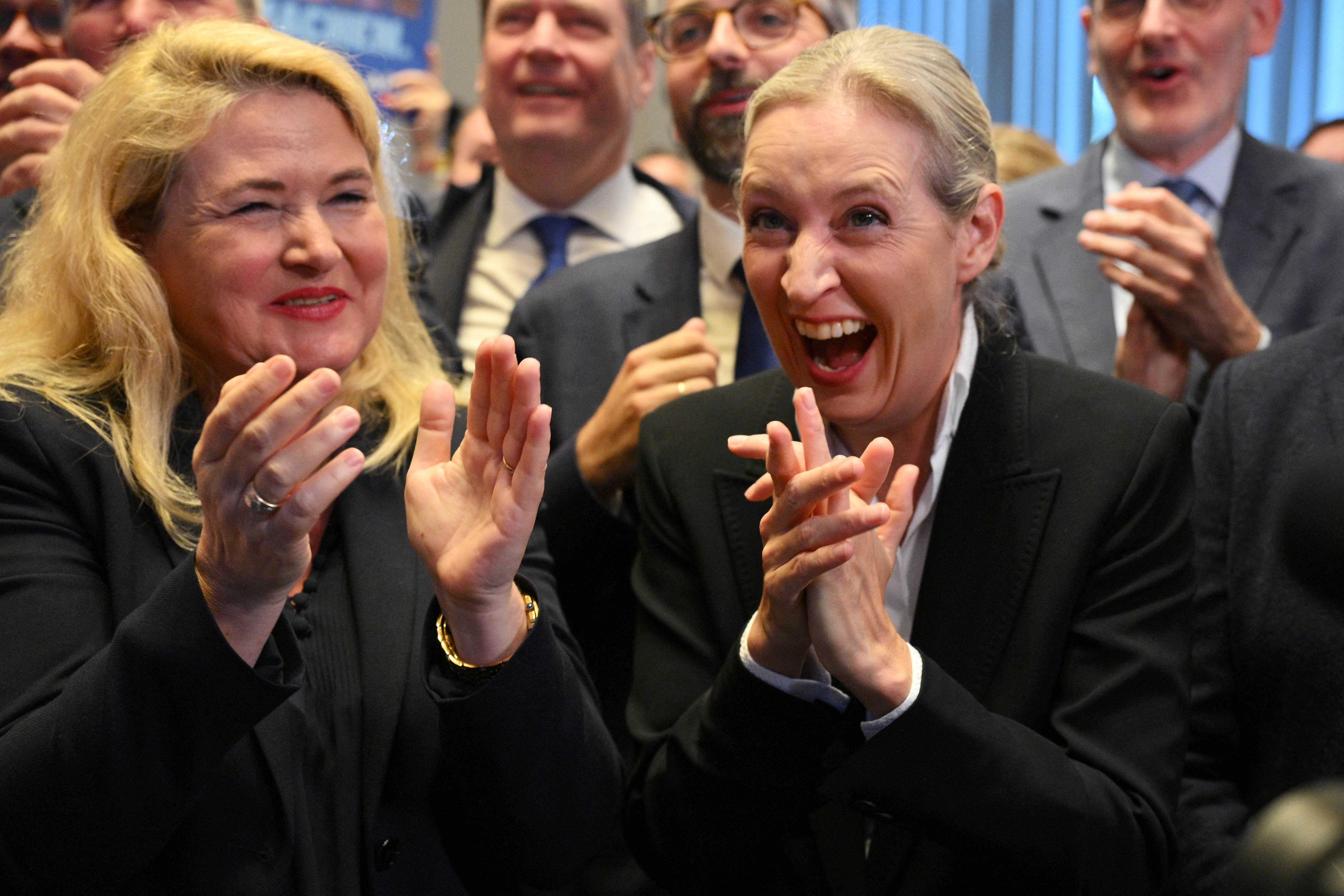 Co-leader of the far-right Alternative for Germany (AfD) party Alice Weidel (R) and AfD top candidate for Berlin Kristin Brinker (L) celebrate after the announcement of the first exit poll results for Mecklenburg-Western Pomeran