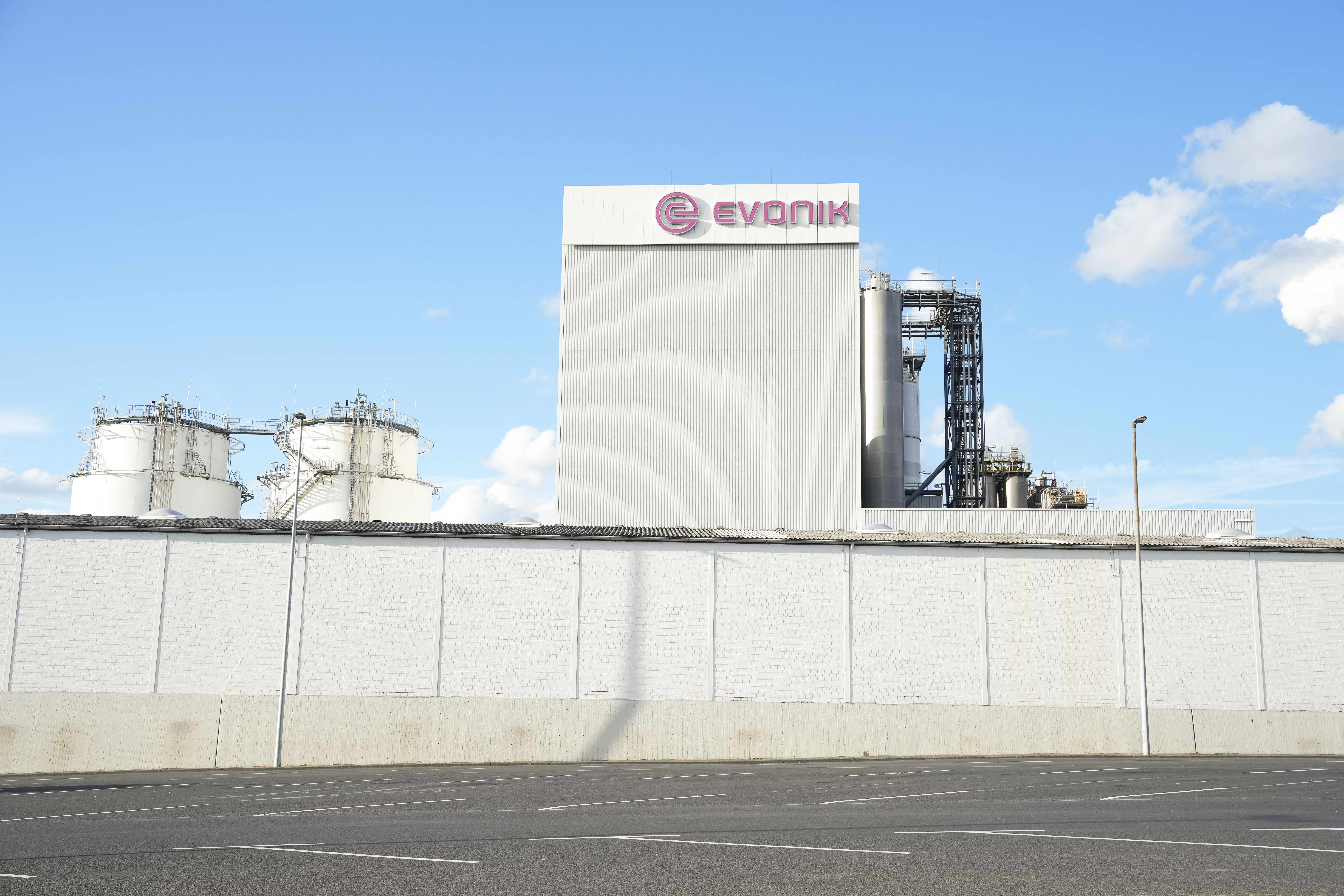 The logo of German chemical company Evonik Industries AG is pictured at the company's site in Wesseling, western Germany on September 1, 2025. (Photo by PAU BARRENA / AFP)