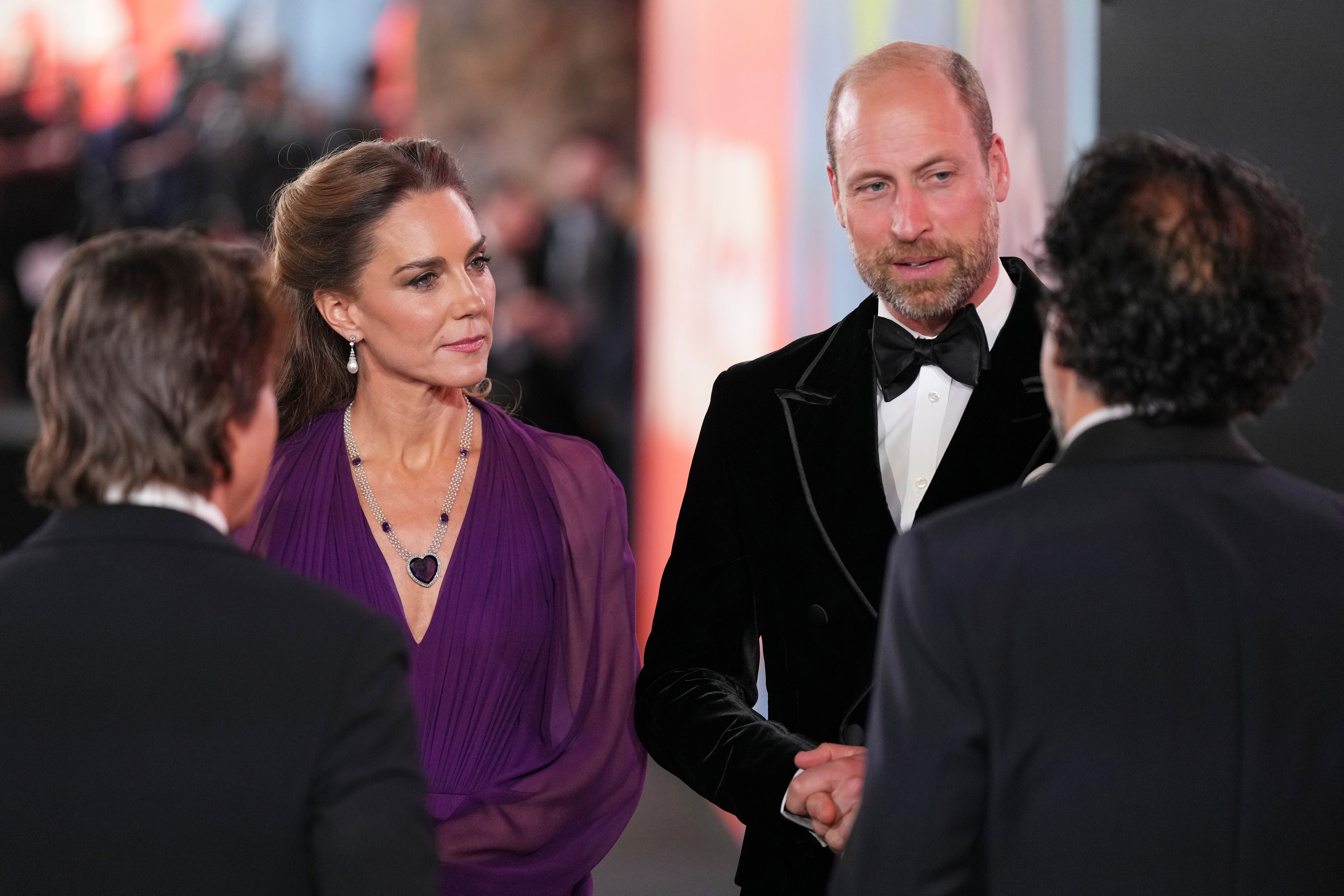 Britain's Kate, Princess of Wales, centre left, and Britain's Prince William, centre right, speak with Tom Cruise, front left, and director Alejandro G. Iñárritu at the World premiere for the film "Digger" in London, Tuesday
