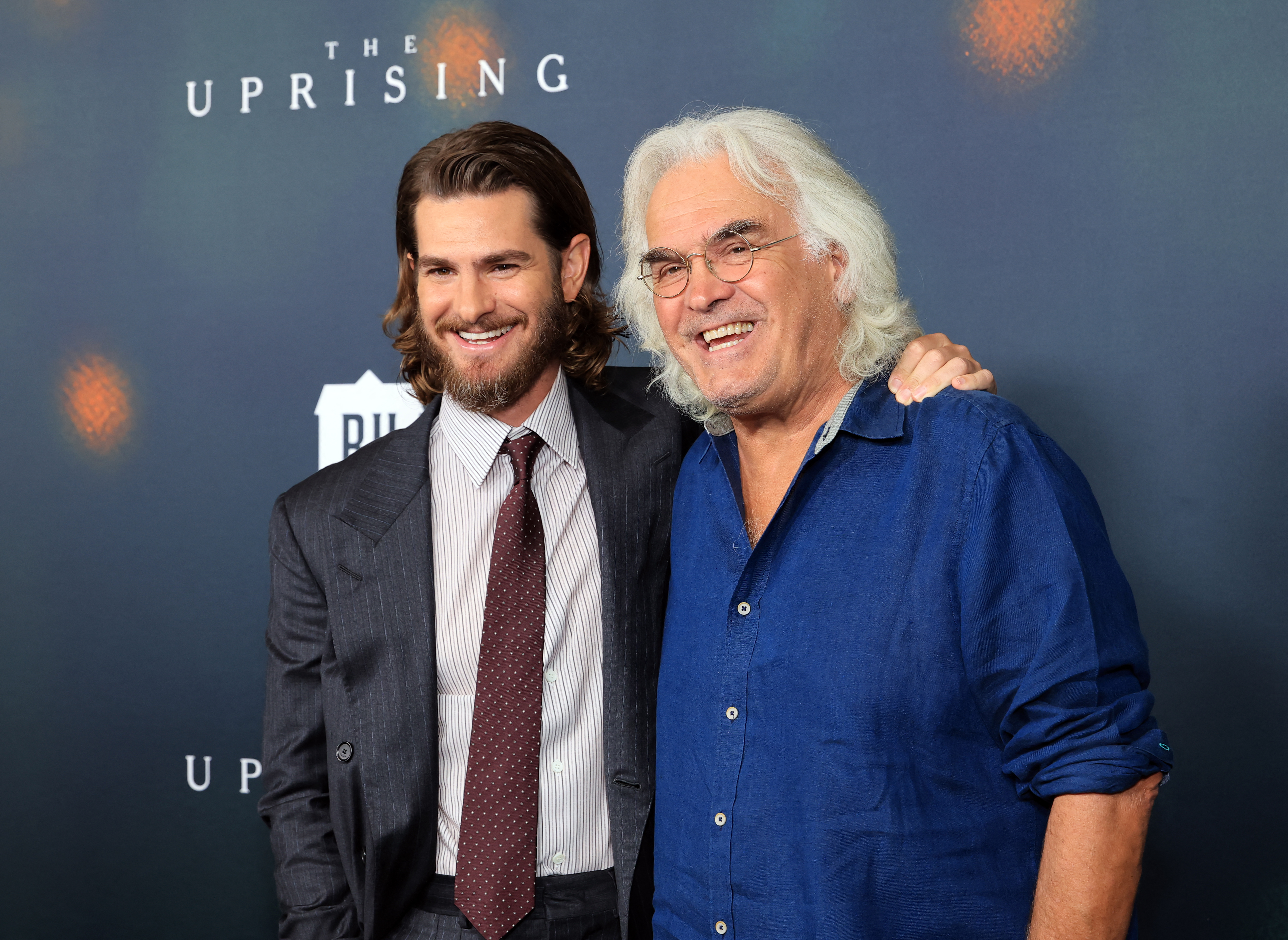 LOS ANGELES, CALIFORNIA - SEPTEMBER 02: (L-R) Andrew Garfield and Paul Greengrass attend the Los Angeles premiere of Focus Features' "The Uprising" at DGA Theater Complex on September 02, 2026 in Los Angeles, California.