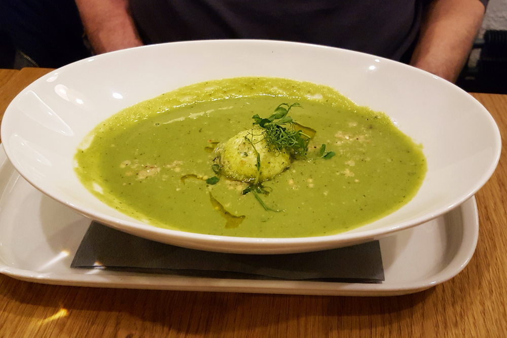 Creamy,Split,Pea,Soup,With,Cheese,Dumpling,And,Shoots,On