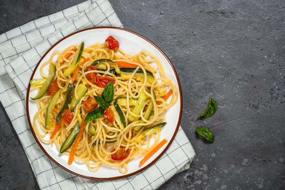 Vegetarian,Pasta.,Pasta,Spaghetti,With,Zucchini,,Carrot,And,Tomatoes,On