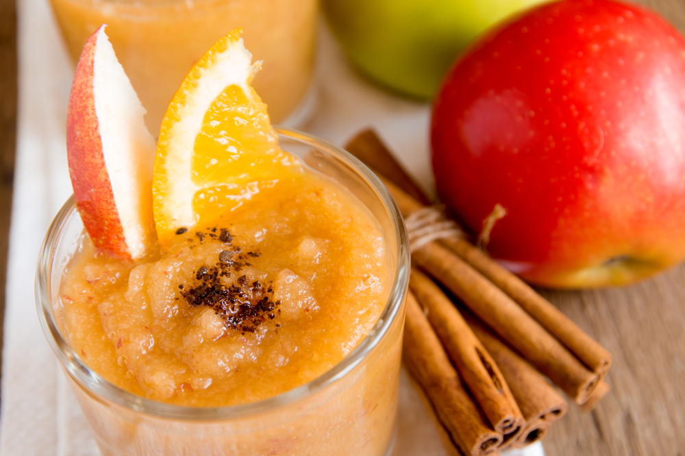 Apple,Orange,Smoothie,Desert,With,Cinnamon,On,Wooden,Table,,Close
